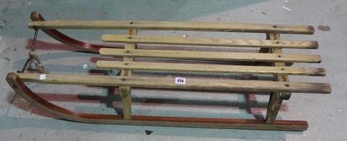 An early 20th century wooden sleigh, 101cm long.  C5