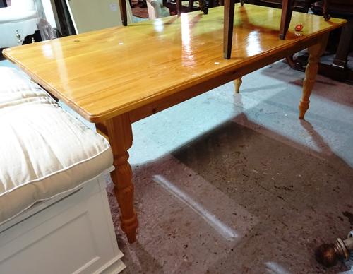 A 20th century pine rectangular dining table and a set of six pine bar back dining chairs, 182cm wide x 78cm high.  M7