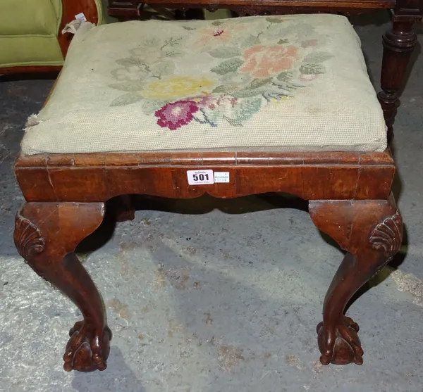 A George I style walnut framed foot stool, on claw and ball feet, 52cm wide.  H1