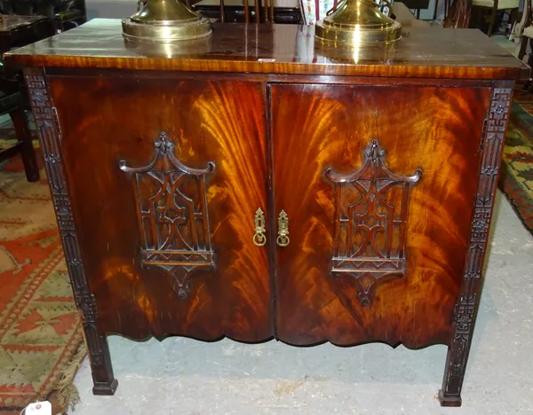 A mahogany two door side cabinet of Chinese Chippendale revival style, 100cm wide x 89cm high.  F6