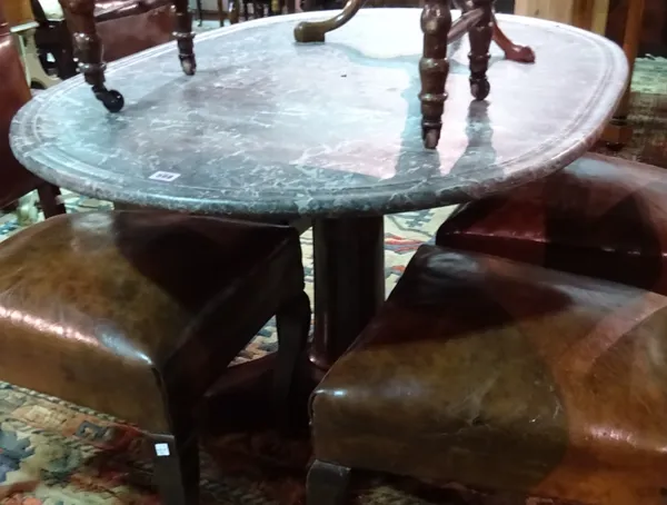 A marble topped centre table, the channelled oval top on an early 19th century French mahogany base with turned column and trefoil platform, 131cm wid