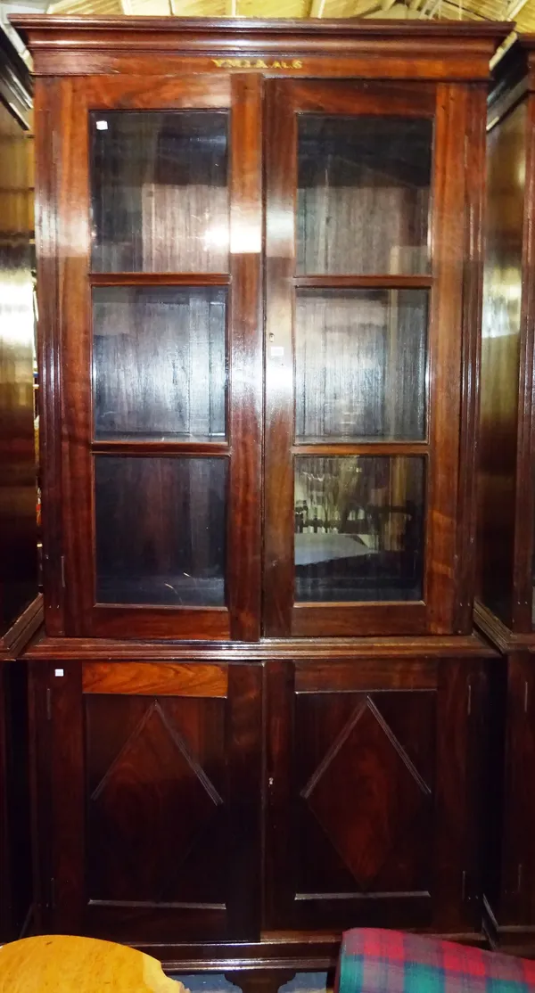 'YMIA MADRAS' An early 20th century Indian rosewood floor standing bookcase cupboard, 269cm wide x 243cm high.  Dis
