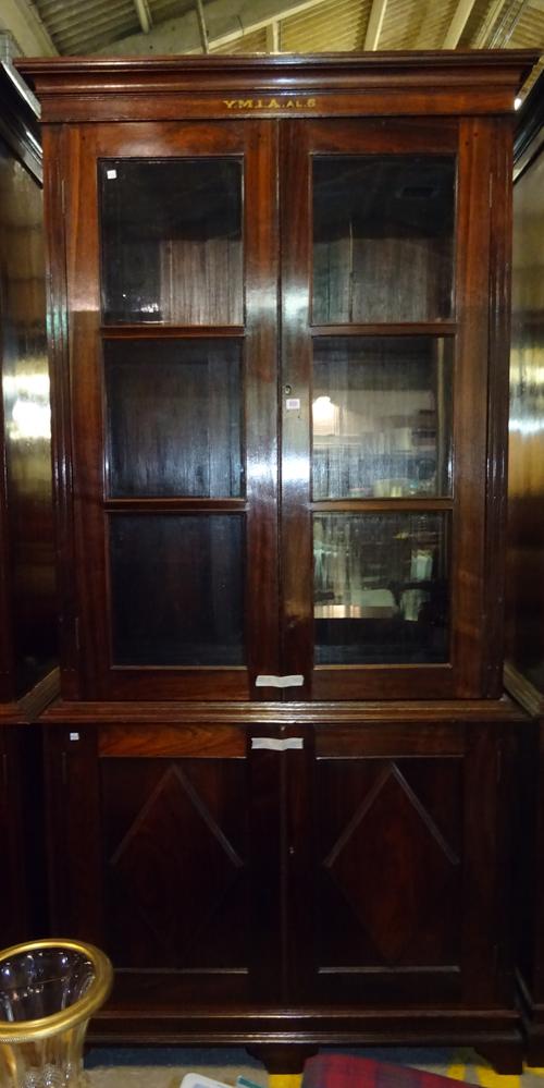 'YMIA MADRAS' An early 20th century Indian rosewood floor standing bookcase cupboard, 119cm wide x 243cm high.  Dis