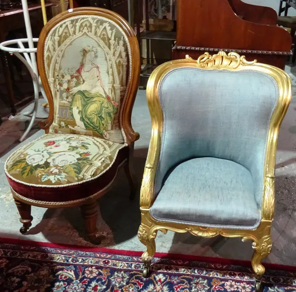 A Victorian gilt framed child's low armchair on scroll supports, together with a Victorian walnut framed spoon back nursing chair with needlework upho