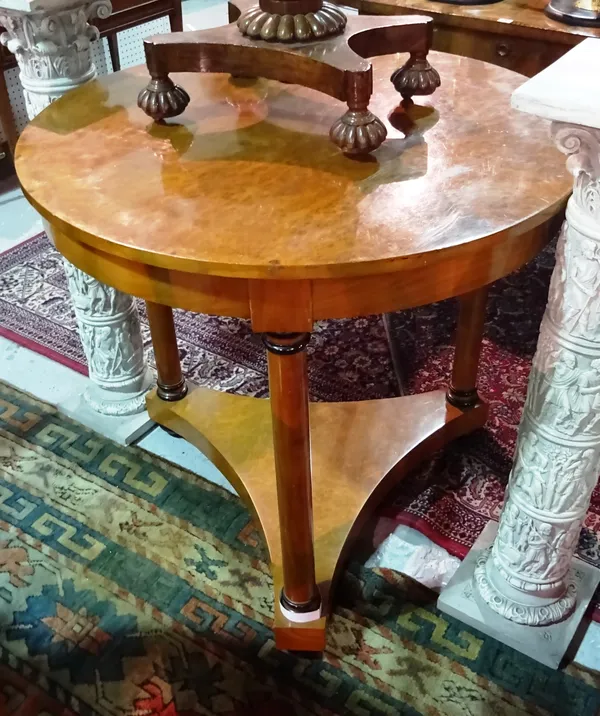 A pair of William IV style burr walnut centre tables, on three turned supports united by trefoil platform undertier, 84cm wide x 80cm high, (2).  E/F8