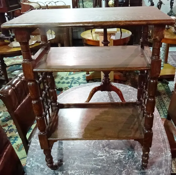 Manner of Liberty; an early 20th century oak three tier side table on turned supports, 60cm wide x 80cm high.  E7