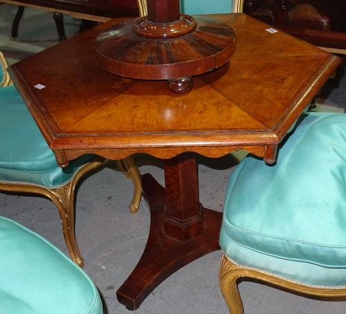A Continental walnut octagonal centre table, with octagonal turned column over a trefoil base on onion feet, 80cm wide x 69cm high.  D3
