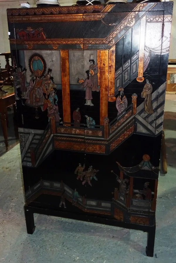 A 20th century Asian ebonised side cabinet on stand, with carved and painted chinoiserie decoration, 94cm wide x 149cm high.  F4