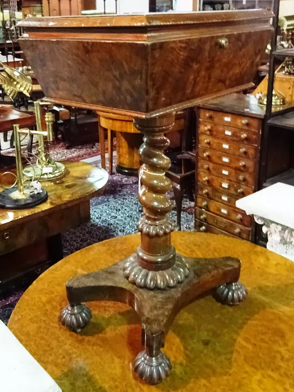 A Victorian walnut sarcophagus shaped teapoy, with fitted interior, spiral twist column and quatrefoil base, with a Bramah lock, 45cm wide x 74cm high