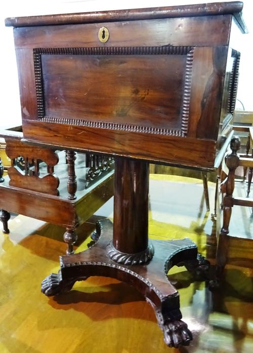 A Victorian mahogany and rosewood work box, with turned column, quatrefoil base and hairy paw feet, 52cm wide x 82cm high.  D8