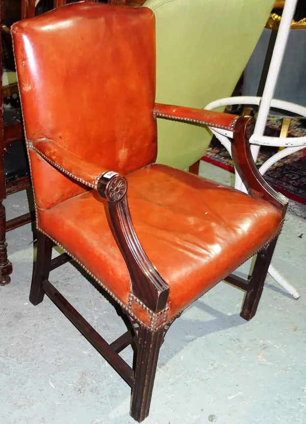 A George III style mahogany Gainsborough chair, with red leather upholstery, on square block supports.  H4