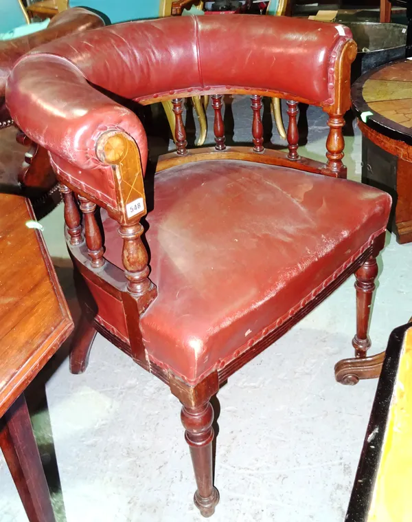 A Victorian mahogany tub back armchair, with red leather upholstery, on tapering supports.  E3