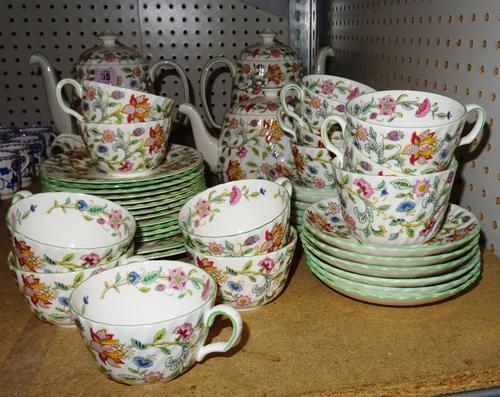 A Minton tea and coffee service, decorated with Haddon Hall pattern, (qty).