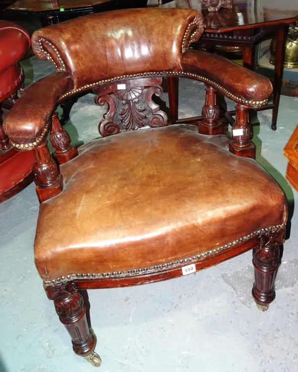 A Victorian mahogany framed tub back desk chair, on fluted tapering supports.  E3