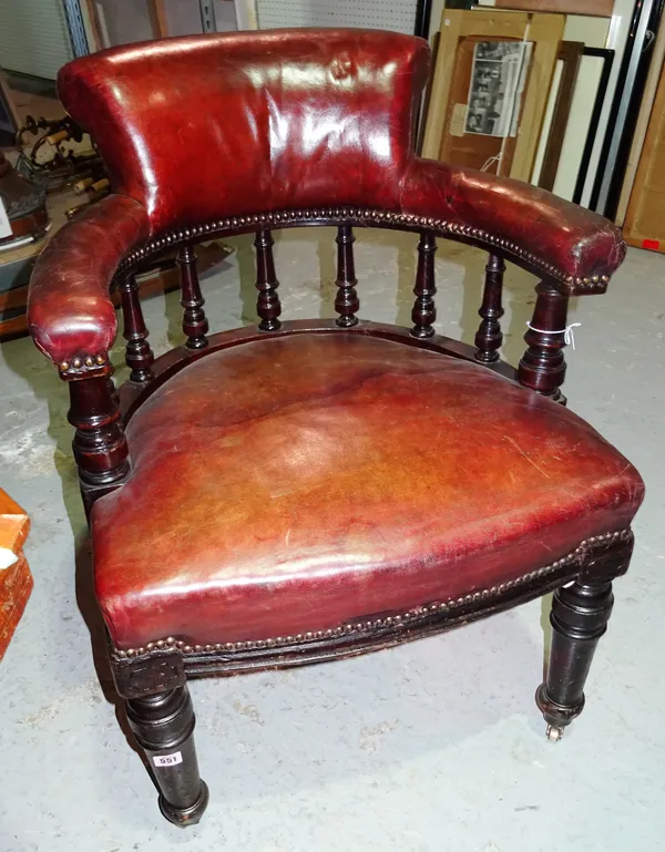 A Victorian mahogany framed tub back desk chair, on tapering supports. E2