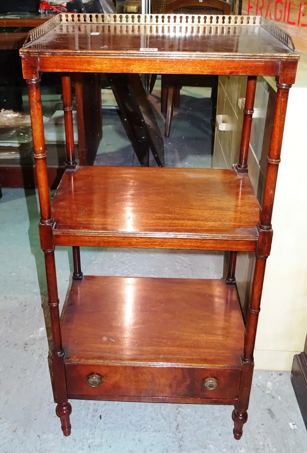 A George III style mahogany three tier what-not, with brass gallery top and single drawer base, 49cm wide x 106cm high.