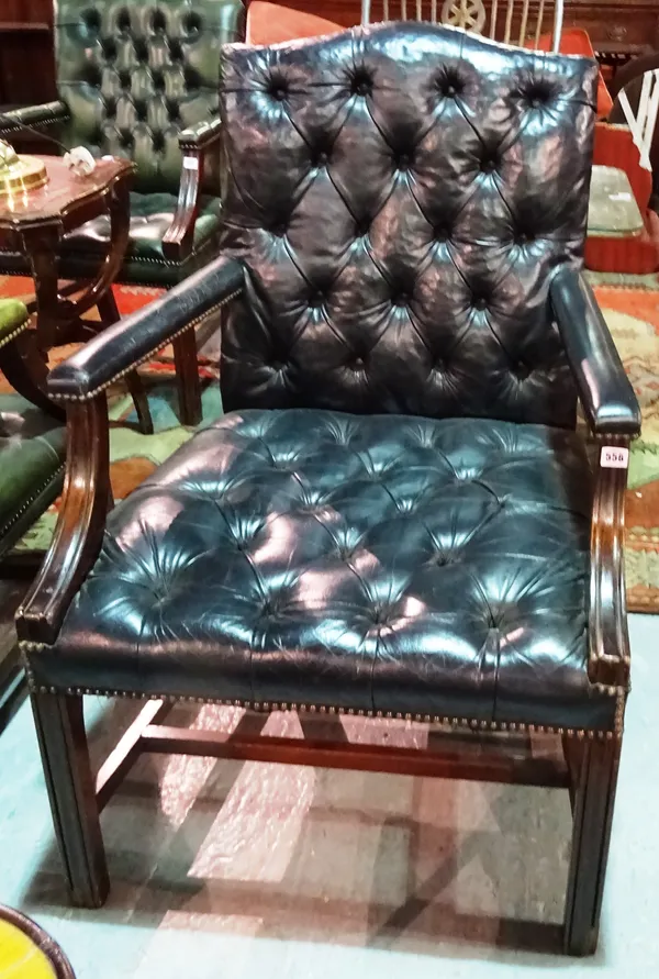 A George III style mahogany framed Gainsborough open armchair, with black leather upholstery, on square block supports.  E5