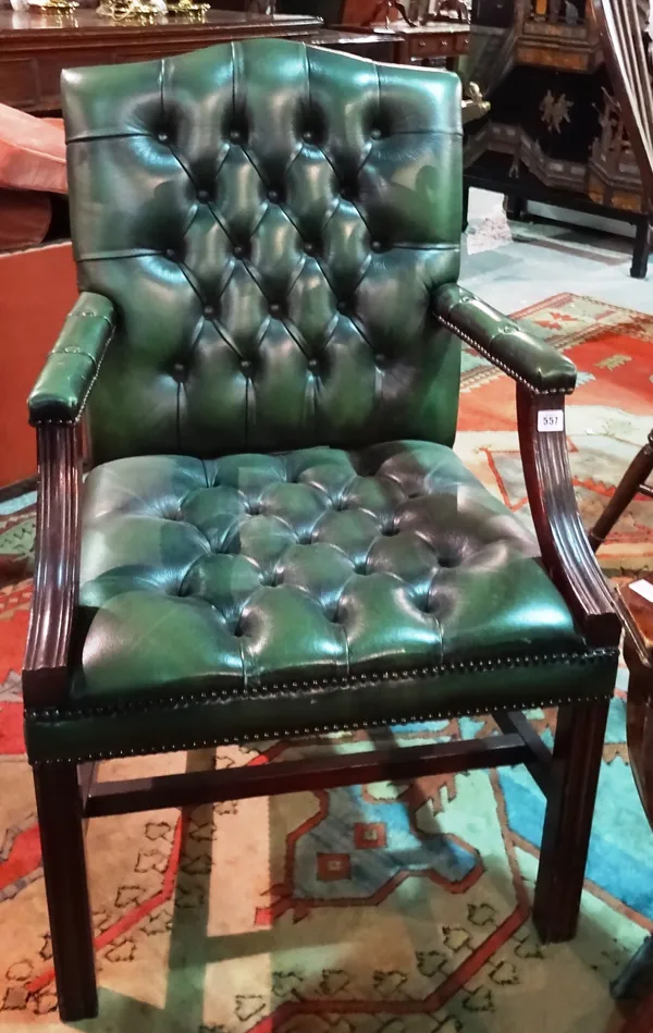 A George III style mahogany framed Gainsborough open armchair, with green leather upholstery, on square block supports, together with another similar,