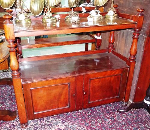 A Victorian mahogany two tier buffet with three-quarter galleried top over pair of cupboard doors on turned supports, 118cm wide x 108cm high.  G8