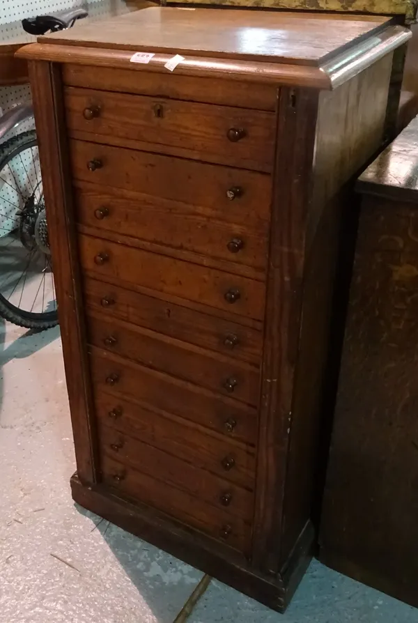 A 19th century stained pine Wellington chest with ten drawers and plinth base, 52cm wide x 105cm high.  B6