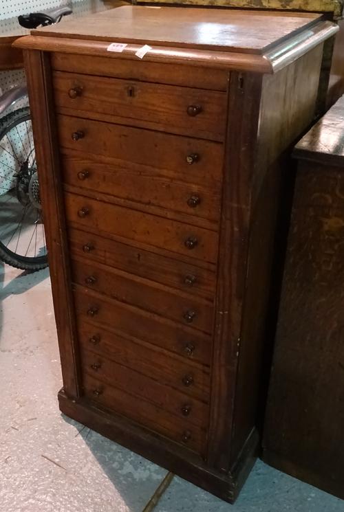 A 19th century stained pine Wellington chest with ten drawers and plinth base, 52cm wide x 105cm high.  B6