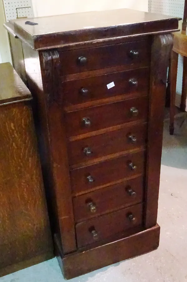 A 19th century mahogany Wellington chest with seven drawers and plinth base, 48cm wide x 107cm high.   B6
