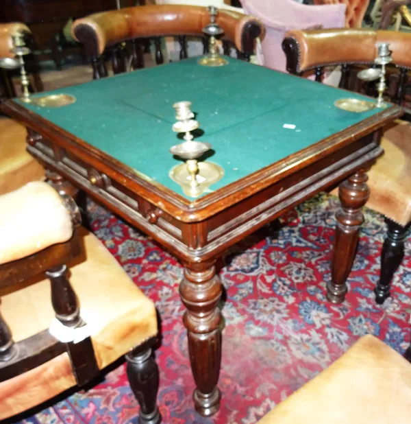 A Victorian oak games table with fitted candlesticks on reeded tapering supports, 77cm wide x 92cm high.  H5