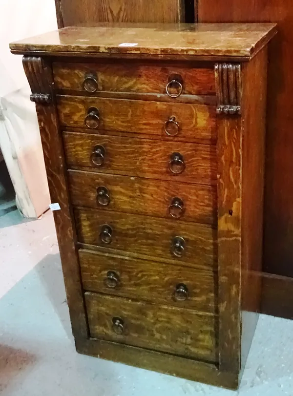 A 19th century oak Wellington chest with seven drawers and plinth base, 50cm wide x 85cm high.  B6