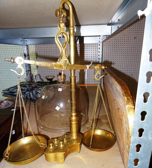 A set of brass balance scales by Librasco, early 20th century, with integral cylindrical weights to the base, 55cm high.  S1