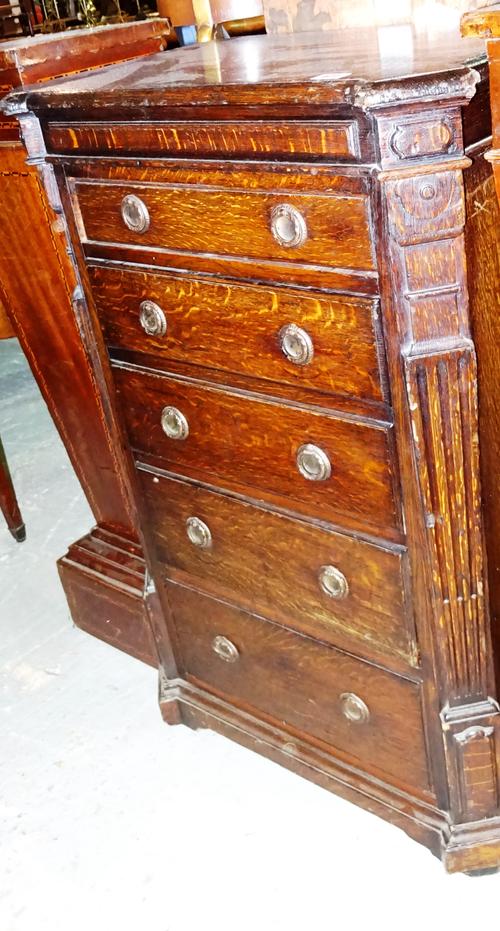 A 19th century tall oak five drawer chest with canted corners and plinth base, 63cm wide x 96cm high.  J8