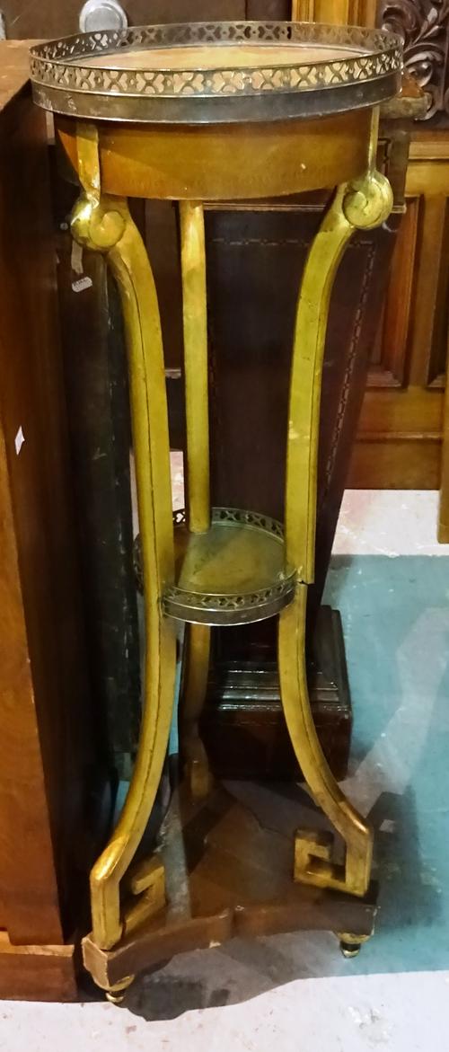 A pair of Regency style mahogany torchère stands with brass galleried top on triform base, 31cm wide x 107cm high.  J8