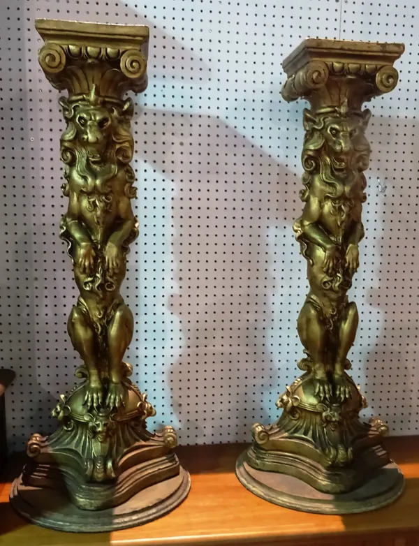 A pair of 20th century gold painted heraldic style jardiniere stands with carved lion central column on plinth base, 23cm wide x 110cm high.  K9