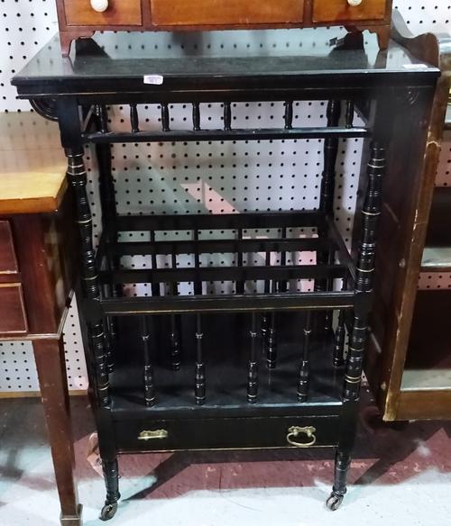 A 19th century ebonised Aesthetic combination Canterbury/side table with rectangular top over single drawer base and turned supports, 61cm wide x 81cm