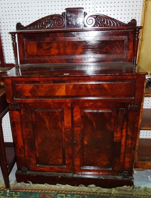 A George III mahogany chiffonier with ledge back over single frieze drawer and pair of panelled cupboards, 91cm wide x 130cm high.   F9