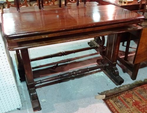A 19th century mahogany metamorphic three tier buffet on trestle supports, united by stretcher, 113cm wide.   E6