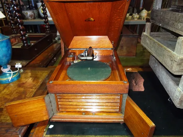 A mid-20th century oak carved table top gramophone.  G2