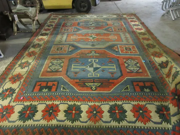 A large Turkish Anatolian carpet, in the Shirvan manner 373cm x 260cm.