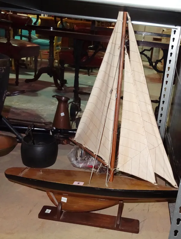 A 20th century model of a pond yacht and stand.  S2