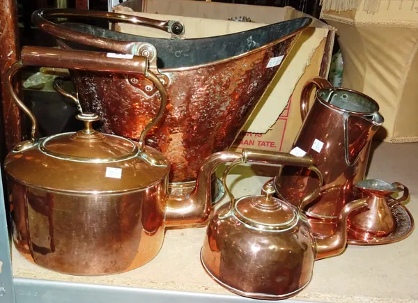 Copper wares, including; a bucket with swing over handle, two kettles, a plate, two jugs and a brass ashtray, (qty).