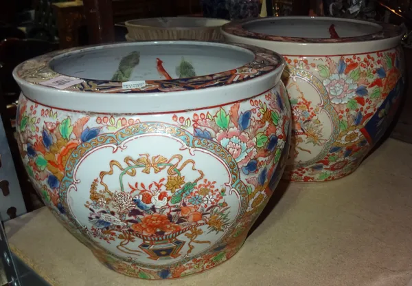 A pair of 20th century Asian fish bowl jardinières, each 27cm diameter, and a Chinese famille-rose tea bowl and saucer painted with figures of young w