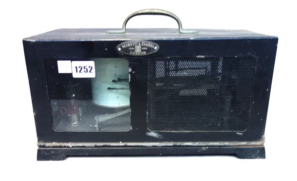A Negretti and Zambra aneroid barograph, in a metal case, together with related accessories.
