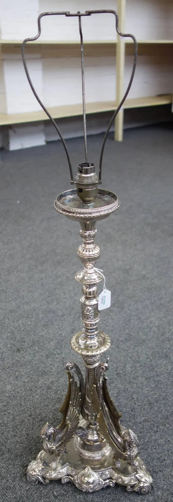 A silver plated centrepiece converted to a table lamp, late 19th century, the stem of knopped form over a tri-form base with monopediae griffin embell