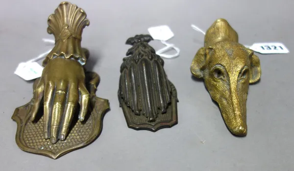 A Victorian gilt brass letter clip formed as a dog's head, a J&R Ratcliffe brass letter clip formed as a lady's hand (16.5cm) and one further foliate