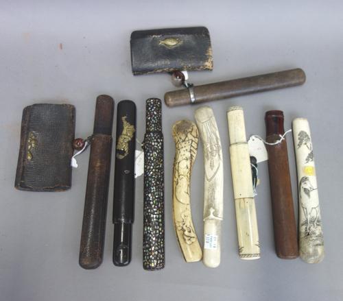 A Japanese pipe case (Kiseru - Zutzu), 19th century, wood and Mother of Pearl inlaid lacquer, another leather bound with pipe and pouch and various ca