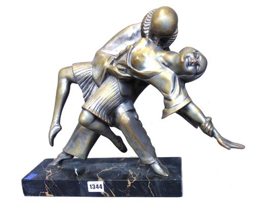 An Art Deco silvered bronze figure group, depicting Pierrot serenading a semi-naked young lady, mounted on a marble plinth (32cm wide) and one further