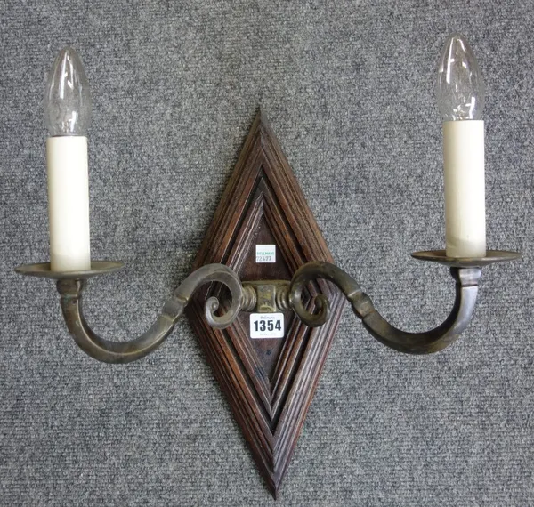 A set of seven modern two branch wall lights, each with diamond form stepped oak back plate issuing two patinated metal swan neck arms, back plate 38c