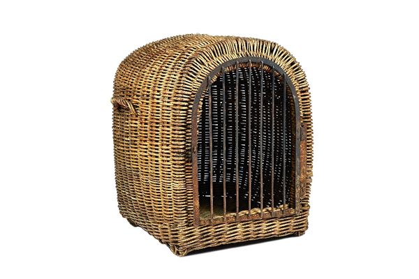A large wicker work dog cage, early 20th century, of domed form, with two carry handles and a wrought iron hinged door. 66cm high.  Illustrated