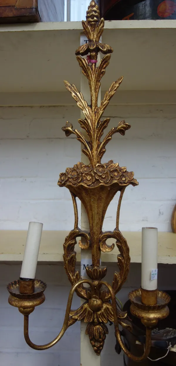 A set of ten Louis XVI style gilt wood two branch wall lights, modern, each back plate relief carved with central cornucopia issuing flowers and with
