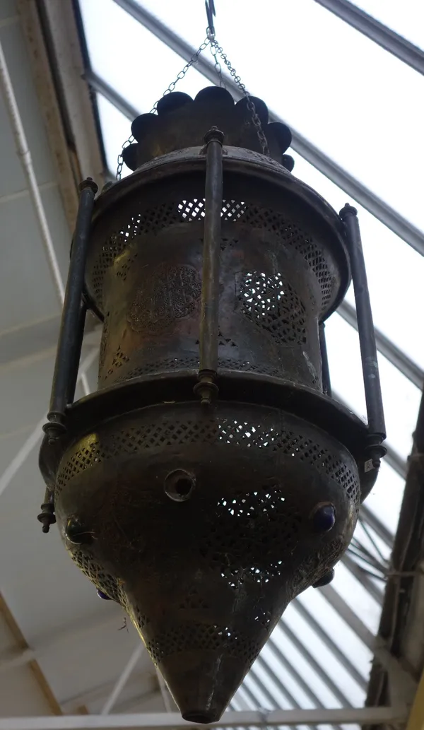 A pair of Middle Eastern sheet metal hanging lanterns, modern, each of pierced cylindrical form, embossed with Islamic script and inset with cabochon