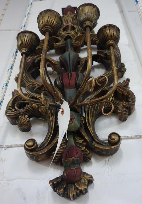 A pair of modern polychrome and gilt wood four branch wall appliques, the pierced back plates of foliate scroll form issuing four gilt metal arms supp